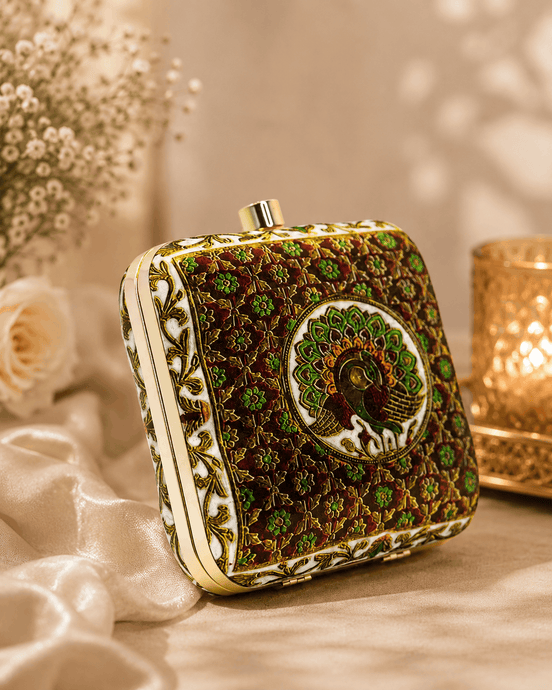 Peacock clutch bag with gold button top and dark green floral embroidery