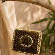 Dark green peacock clutch with gold chain and framed clasp front