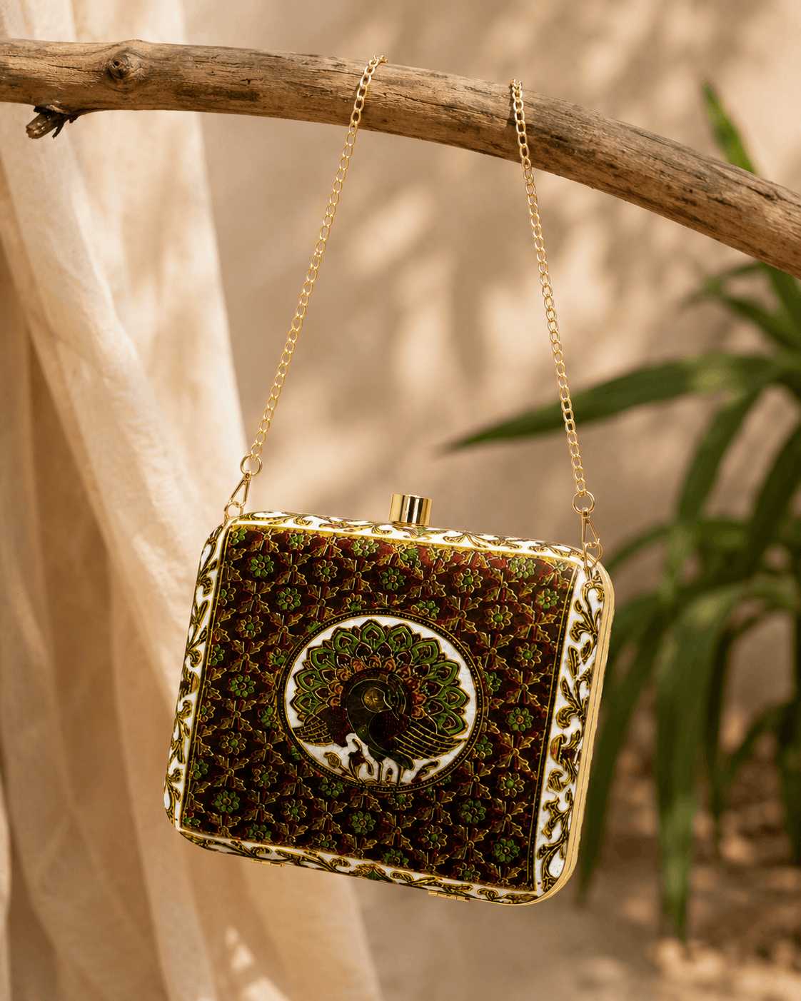Dark green peacock clutch with gold chain and framed clasp front
