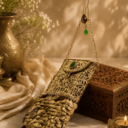 Gold filigree mobile clutch with chain strap, jeweled green and purple accents, coin tassel base