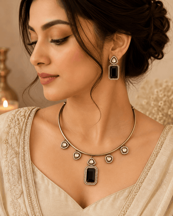 Gold-tone necklace with dark green and black square pendant and matching earrings