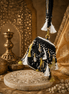 Black beaded potli bag with tassel fringe and gold-tone ring handle