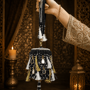 Black beaded potli bag with long tassel cords and gold-tone chain