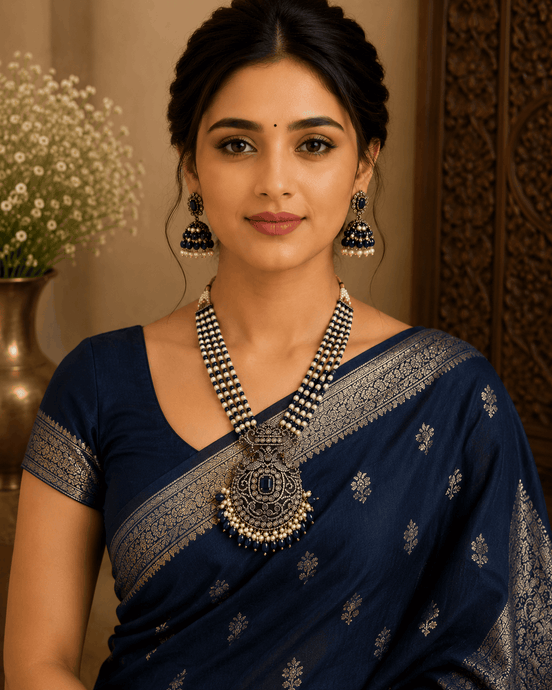 Navy blue beaded pearl necklace set with ornate pendant and matching dangling earrings