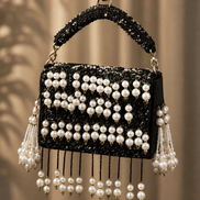 Black pearl shoulder bag with front bead stripes and two hanging tassel strands
