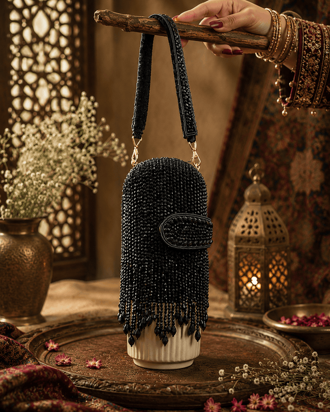 Black beaded velvet potli clutch with wrist strap and rounded flap