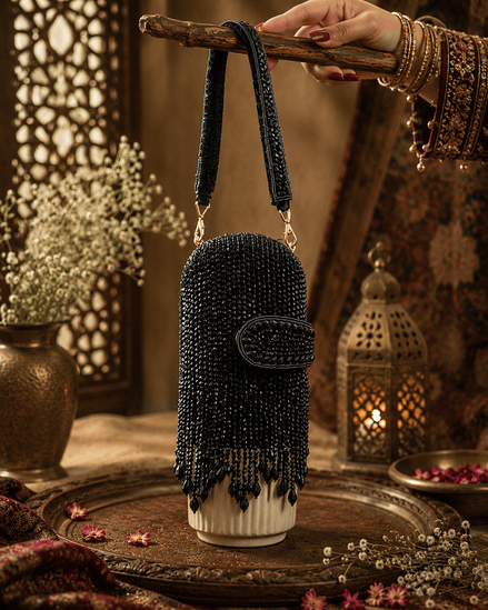 Black beaded velvet potli clutch with wrist strap and rounded flap