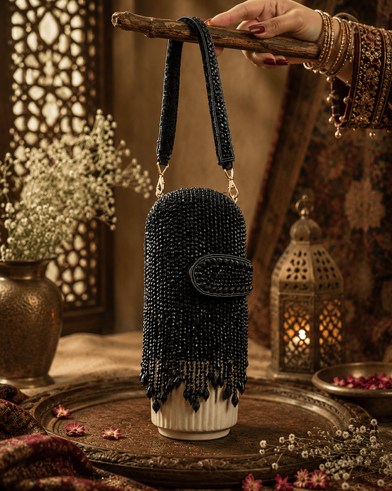 Black beaded velvet potli clutch with wrist strap and rounded flap