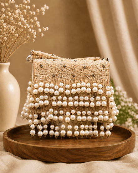 Pink woven pearl shoulder bag with layered bead bands and dangling pearl tassel trim