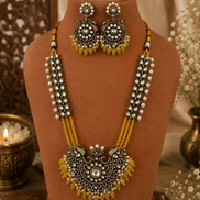 Gold-tone beaded long necklace set with ornate yellow pendant and dangling pearl-like earrings