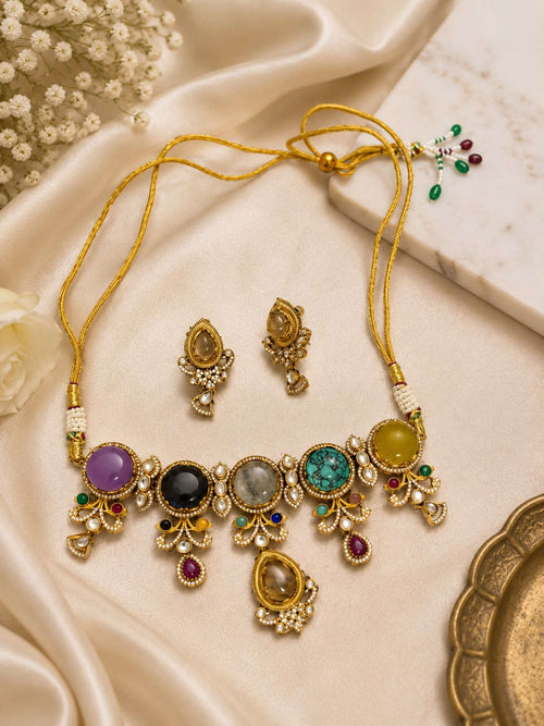 Gold-tone stone statement necklace set with multicolor teardrop charms and matching earrings