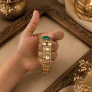Gold Kada bracelet with green oval stones and three round pearl settings