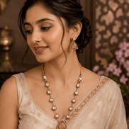 Layered heritage necklace with dark teardrop pendant and gold bead chain