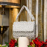 Silver crystal shoulder bag with top handle and beaded fringe flap