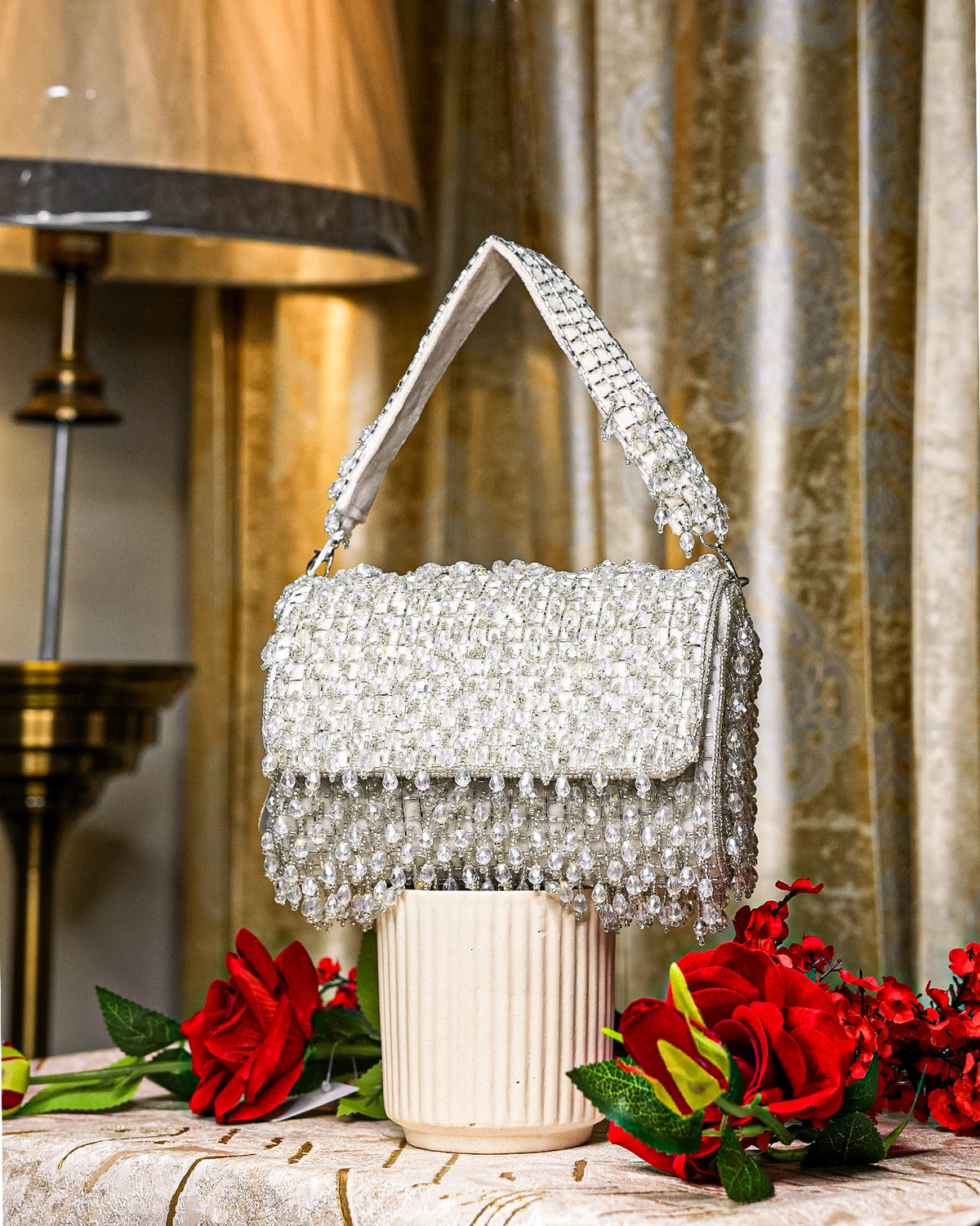 Silver crystal shoulder bag with top handle and beaded fringe flap