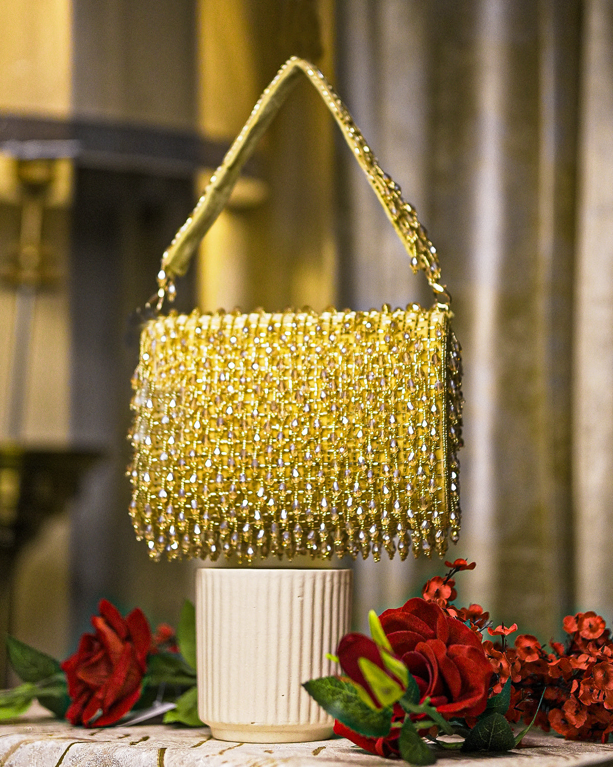 Gold crystal shoulder bag with chain strap and dense beaded fringe top
