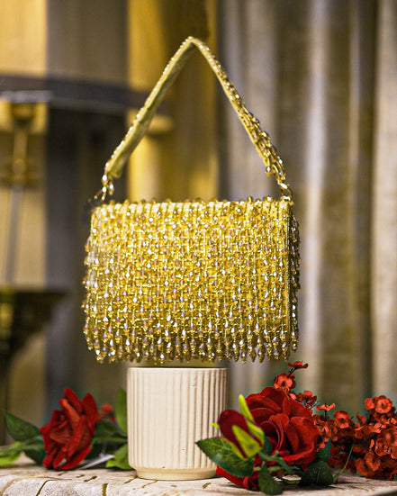 Gold crystal shoulder bag with chain strap and dense beaded fringe top