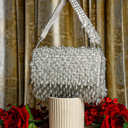 Silver crystal shoulder bag with beaded mesh body and fringed front flap