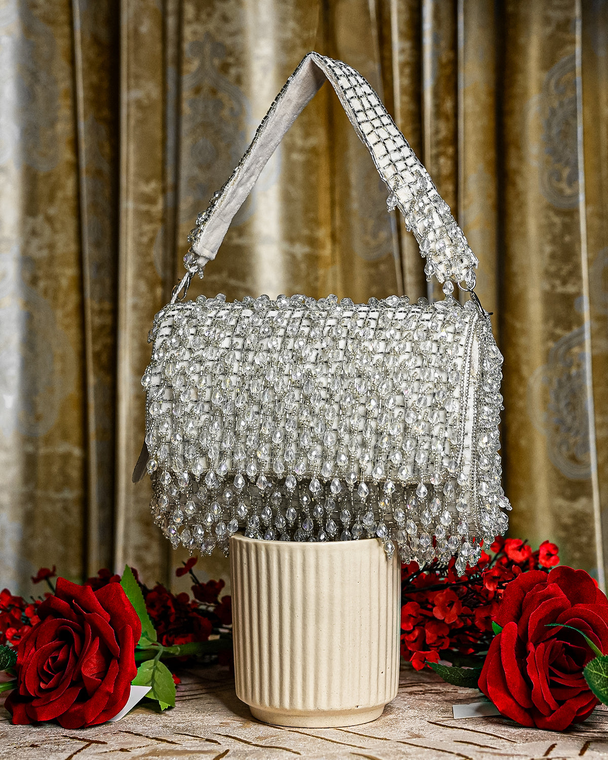 Silver crystal shoulder bag with beaded mesh body and fringed front flap