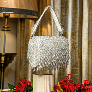 Silver crystal shoulder bag with beaded mesh flap and fringed handle edges