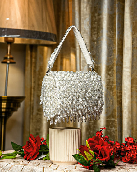 Silver crystal shoulder bag with beaded mesh flap and fringed handle edges