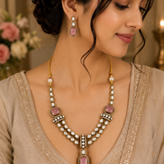 Gold kundan necklace set with pink teardrop pendant and pearl bead chain, with drop earrings