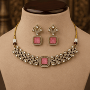 Gold-tone choker with ruby-pink square center stone and matching stud drop earrings display.
