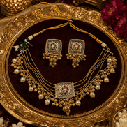 Gold-tone necklace set with red green square pendant, matching pearl drop earrings