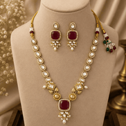 Gold-toned necklace set with maroon square pendant and matching round drop earrings