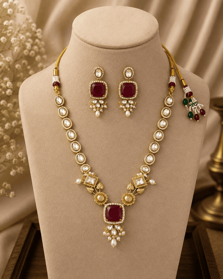 Gold-toned necklace set with maroon square pendant and matching round drop earrings