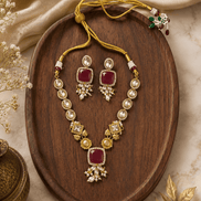 Gold-toned necklace set with ruby red square pendant and floral pearl earrings