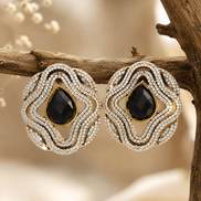Brass-tone statement stud earrings with black teardrop center in double crystal rows
