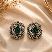 Brass-tone statement stud earrings with green teardrop center and crystal surround