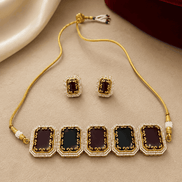 Statement choker set with gold cord and square enamel links, paired with stud earrings