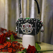 Black beaded box clutch with ornate jeweled front and long top handle