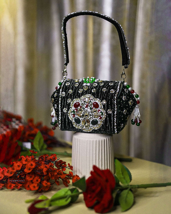 Black beaded box clutch with ornate jeweled front and long top handle