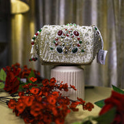 Beige embellished box clutch with jeweled beadwork and crystal accents, top handle