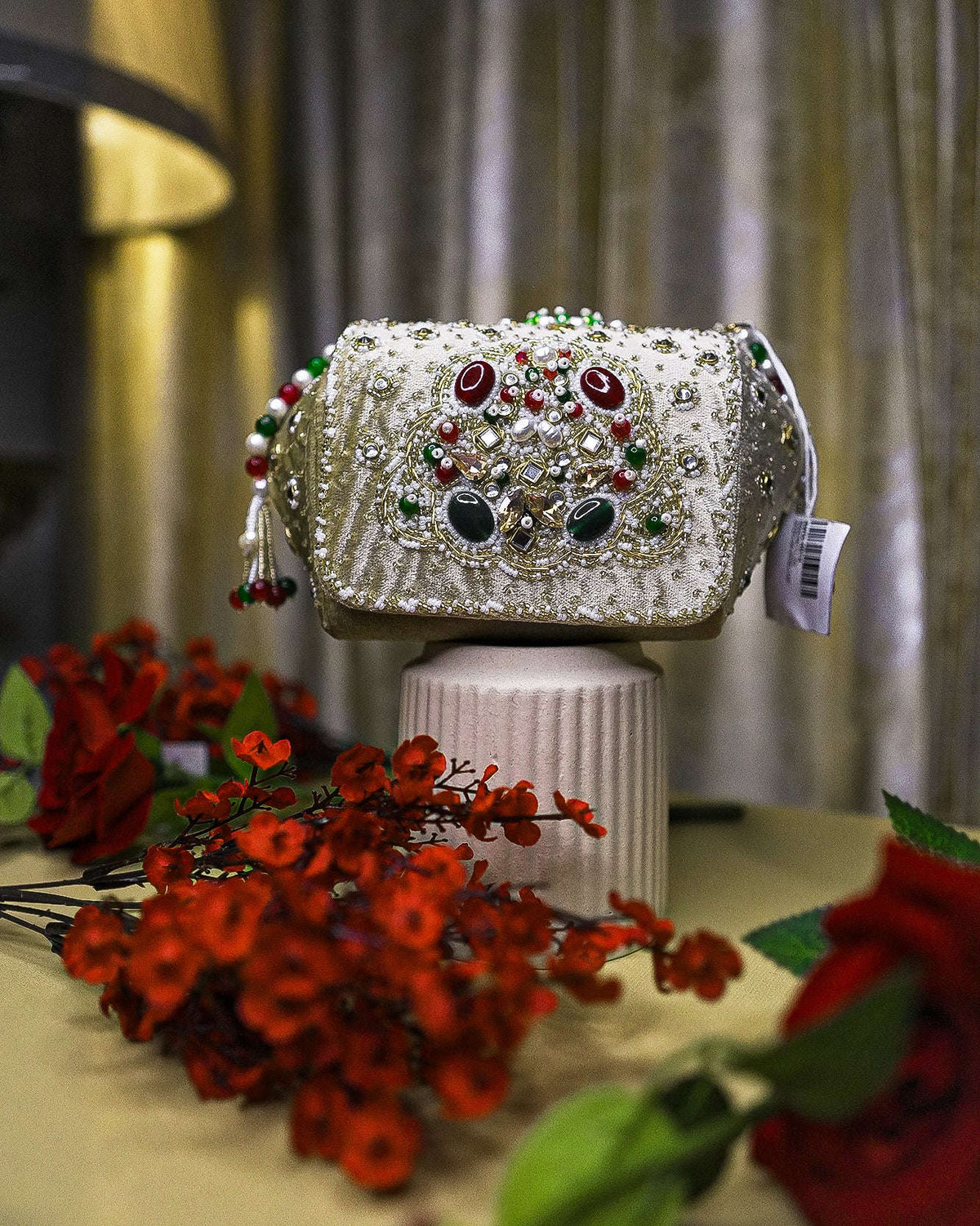 Beige embellished box clutch with jeweled beadwork and crystal accents, top handle