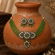 Green floral choker set with layered bead necklace and matching dangling earrings