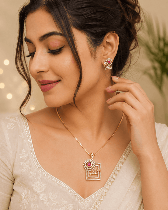 Ruby red pendant necklace with matching earrings on model, geometric square design