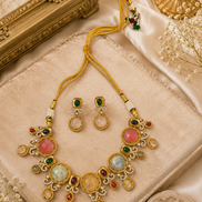 Gold-tone necklace and earrings set with green, red, blue and light round stones