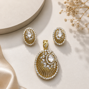 Gold-tone pendant with clear oval halo and matching stud earrings