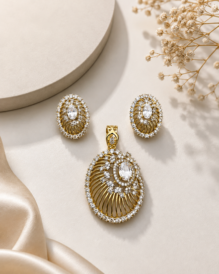 Gold-tone pendant with clear oval halo and matching stud earrings