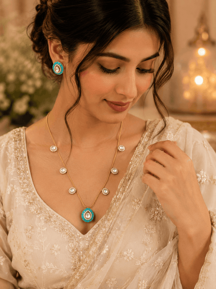 Gold-tone necklace with turquoise center pendant and matching stud earrings, small round links