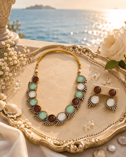 Beaded multicolor stone necklace with matching earrings on decorative tray