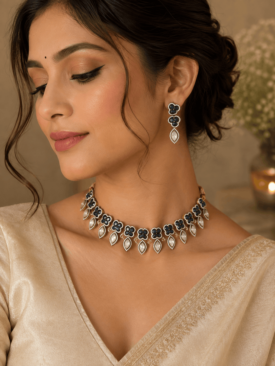 Teal and gold necklace with teardrop earrings worn on model