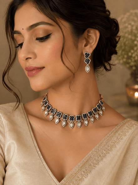 Teal and gold necklace with teardrop earrings worn on model