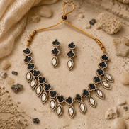 Gold cord necklace with teal teardrop charms and matching drop earrings