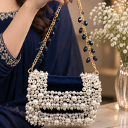 Pearl bead mini bag with gold chain handle and ruched navy fabric panel