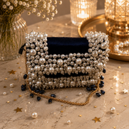 Pearl-beaded mini bag with navy interior and gold chain strap